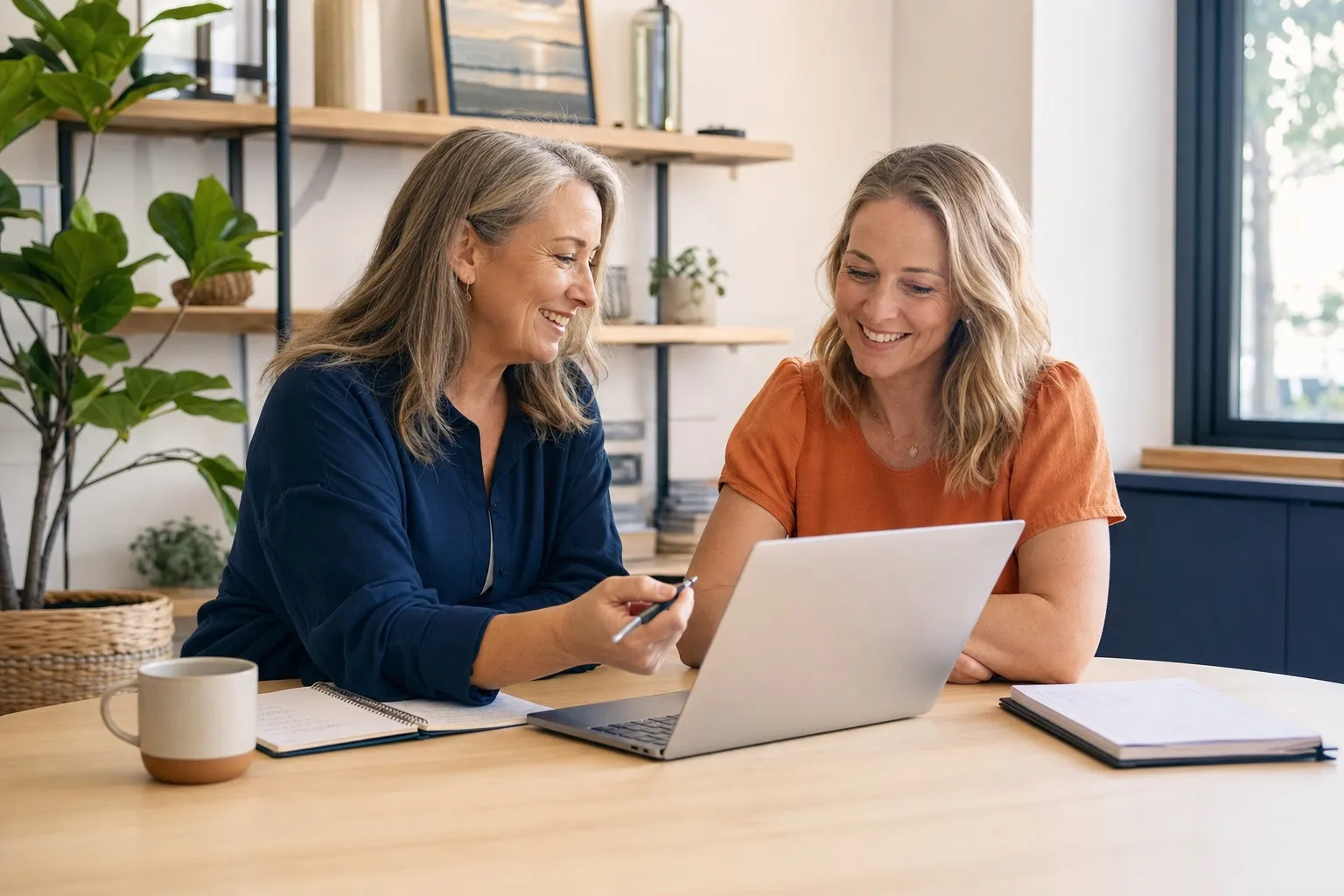 New Zealand bookkeeper helping a small business owner review their accounts