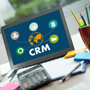 Team discussing how to pick a CRM in office meeting